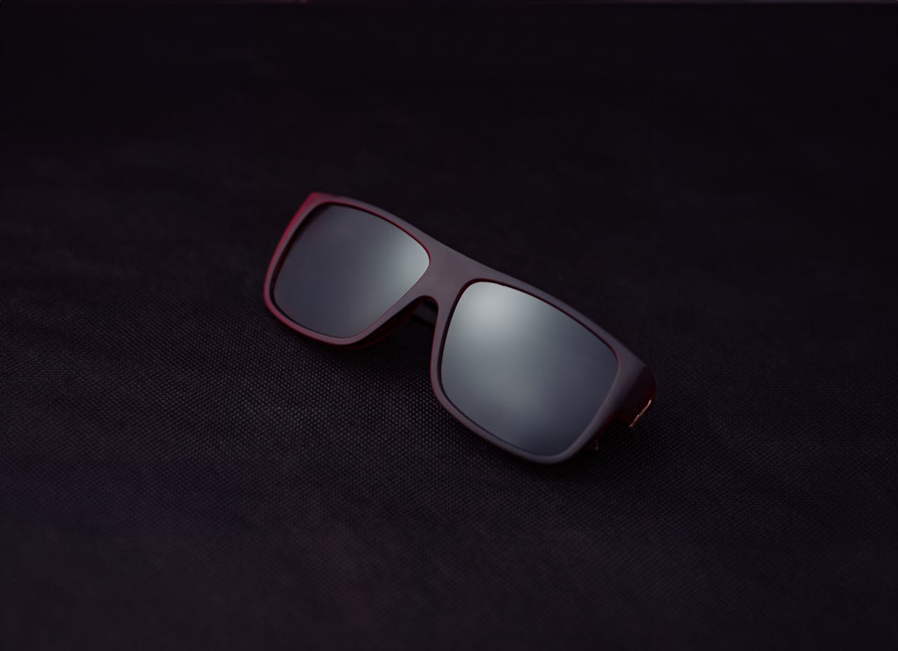 Close-up of modern sunglasses on a dark background. Perfect for fashion and accessory concepts.